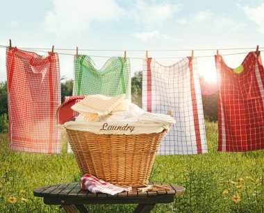 Cotton towels drying on the clothesline clipart