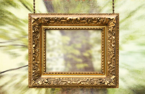 Vergulde frame opknoping met abstracte achtergrond — Stockfoto