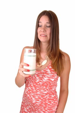 Girl doesn’t like milk. clipart