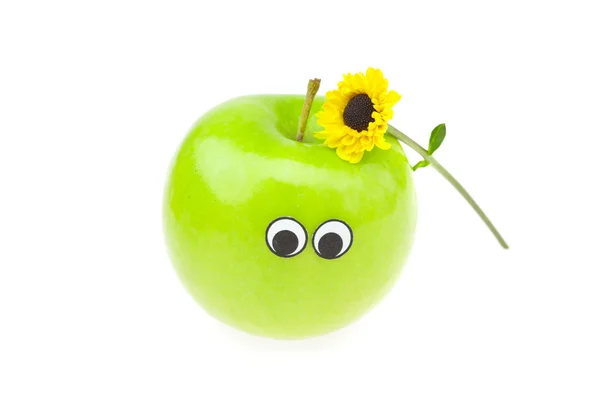 Skämt apple med ögon och en blomma isolerad på vit — Stockfoto