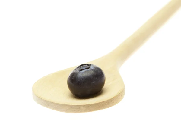 Blueberry on the wooden spoon isolated on white — Stock Photo, Image