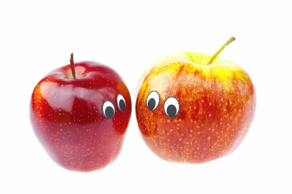 Manzanas con rostros de alegría aislados en blanco —  Fotos de Stock