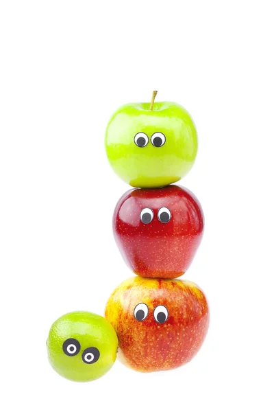 Jabłka z radością twarze na białym tle — Zdjęcie stockowe
