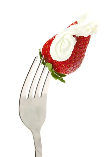 Strawberries and cream on fork isolated on white — Stock Photo, Image