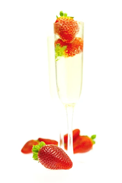 Strawberries in a glass of champagne isolated on white — Stock Photo, Image