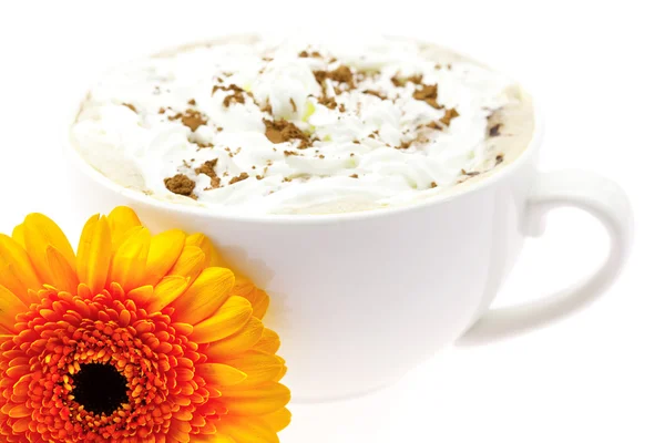 Cappuccino with orange flower is isolated in white — Stock Photo, Image