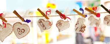 Gingerbread hanging from a rope clipart