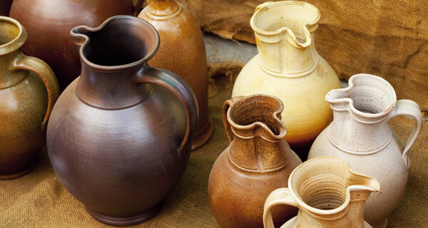 Earthenware jars standing on linen rag