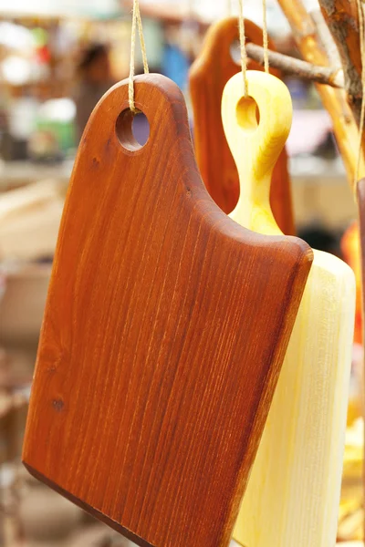 Chopping boards hanging on a rope — Stock Photo, Image