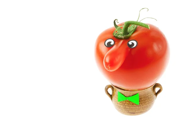 Tomato with a nose lying in a small jug isolated on white — Stock Photo, Image