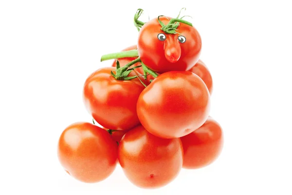 Tomato with a nose and a bunch of tomatoes isolated on white — Stock Photo, Image