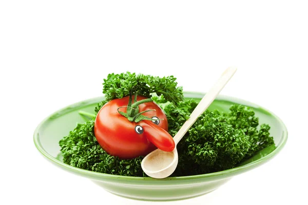 Pomidor z nosa na zielony talerz na białym tle — Zdjęcie stockowe