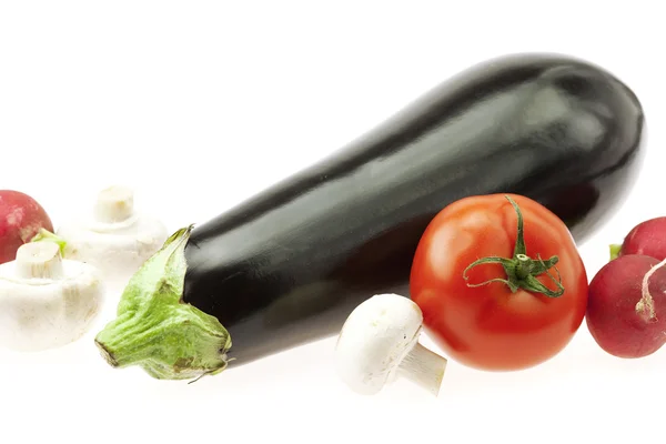 Eggplant radishes tomatoes and mushrooms isolated on white — Stock Photo, Image