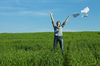 Man throws the paper in the field clipart