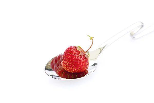 Strawberry in a spoon isolated on white — Stock Photo, Image