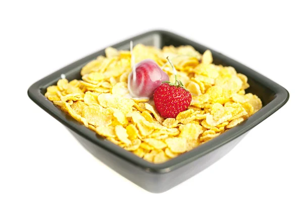 Bowl of cornflakes milk cherry and strawberry isolated on whi — Stock Photo, Image