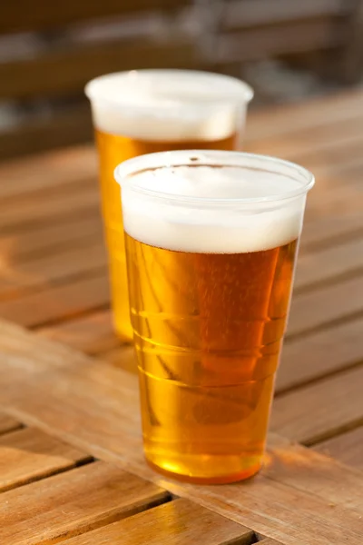 Beer standing on a wooden table — Stock Photo, Image