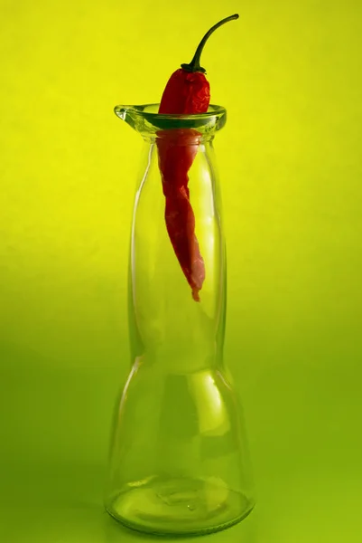 Chili pepper in a glass bottle — Stock Photo, Image