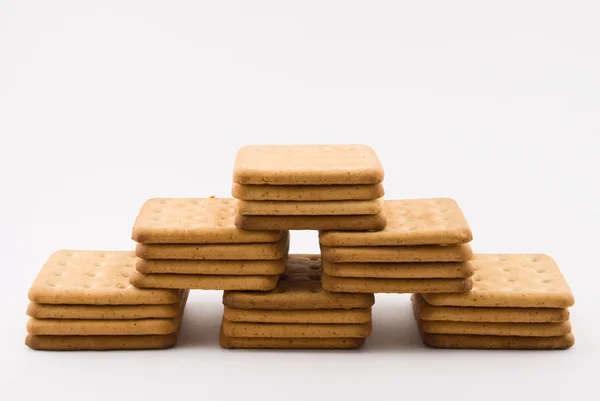 Berg av cookies är isolerad på en vit — Stockfoto