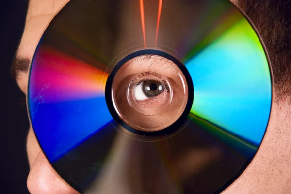 stock image Portrait of a man looking through a CD