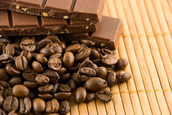 stock image Chocolate and coffee beans on a bamboo mat