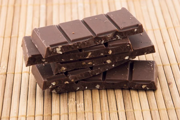 Chocolate on a bamboo mat — Stock Photo, Image