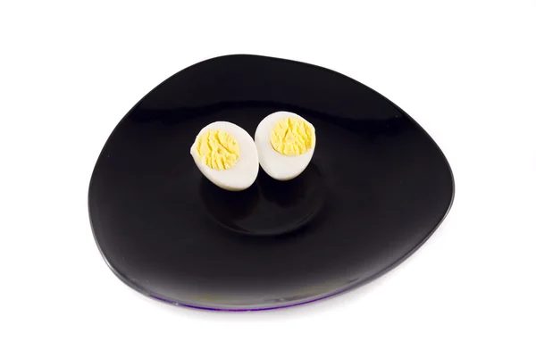 Bıldırcın yumurtası beyaz izole bir plaka üzerinde — Stok fotoğraf