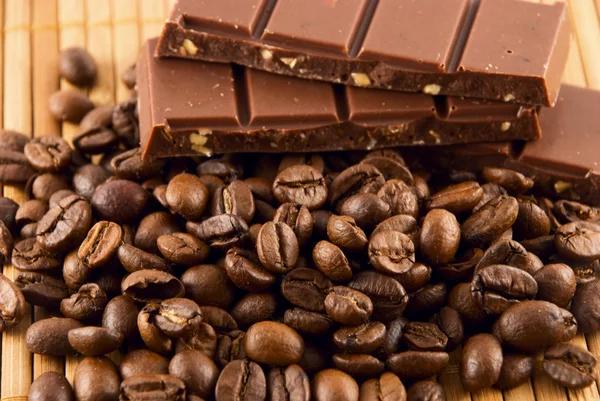 stock image Chocolate and coffee beans on a bamboo mat