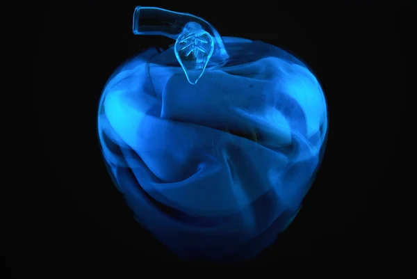 Glass apple on a black background — Stock Photo, Image