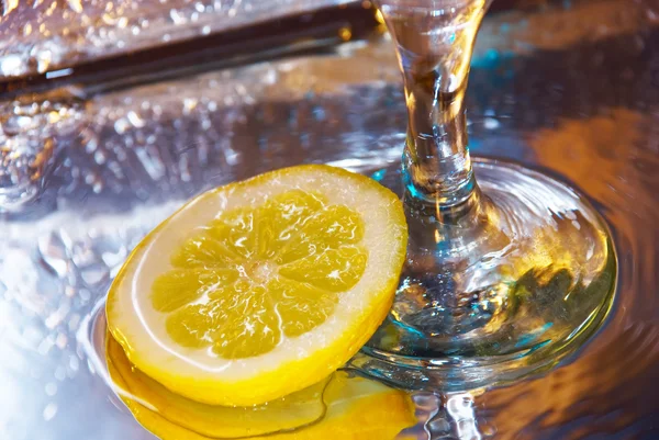 Lemon and a wine glass — Stock Photo, Image