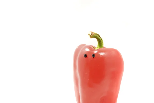 Rote Paprika mit isolierten Augen auf weißem Hintergrund — Stockfoto
