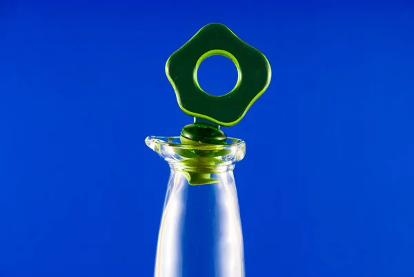 Bottle on a blue background — Stock Photo, Image