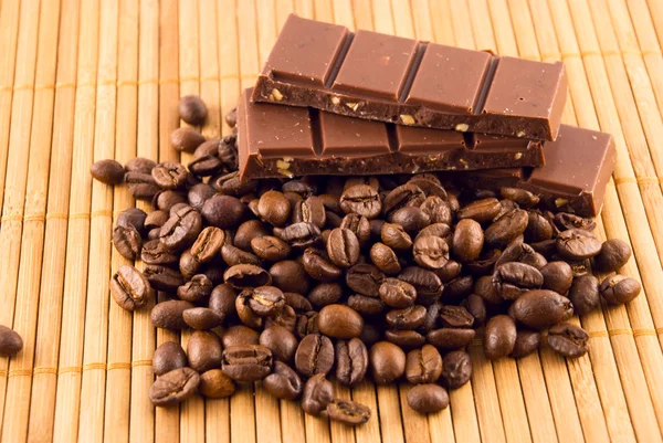 stock image Chocolate and coffee beans on a bamboo mat