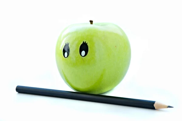 Green apple with pencil isolated on white — Stock Photo, Image