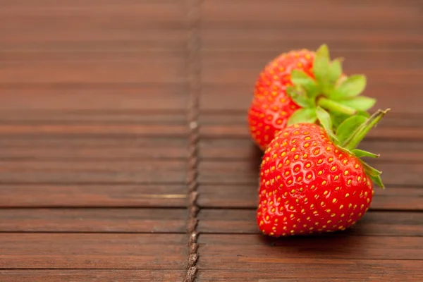 Strawberries on a bamboo mat — Stock Photo, Image
