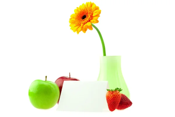 Gerbera in a vase apples postcard and strawberries isolated on w — Stock Photo, Image