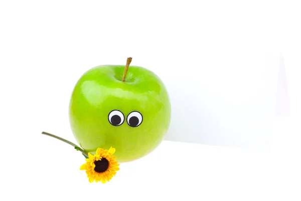 Manzanas con ojos y caras y una flor aislada en blanco —  Fotos de Stock