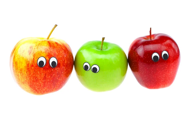 Manzanas con ojos y rostros aislados en blanco — Foto de Stock