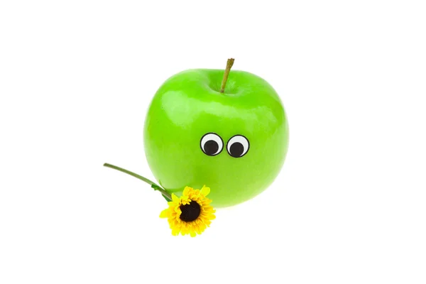 Äpfel mit Augen und Gesichtern und einer Blume auf weißem Grund — Stockfoto