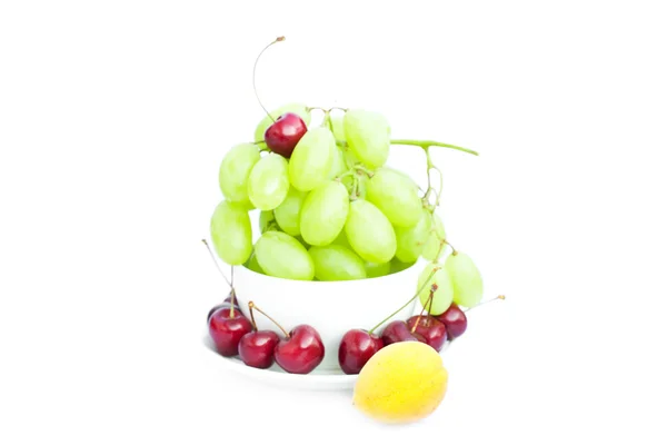 Grapes cherry apricot in the cup is isolated on white — Stock Photo, Image