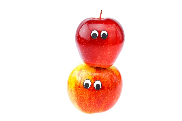 Manzanas con ojos y rostros aislados en blanco — Foto de Stock