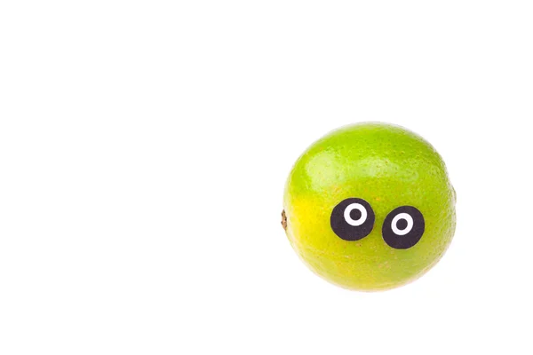 Gözleri ve yüzler üzerinde beyaz izole limon — Stok fotoğraf
