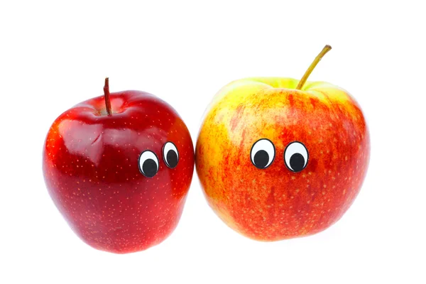 Pommes avec les yeux et les visages isolés sur blanc — Photo