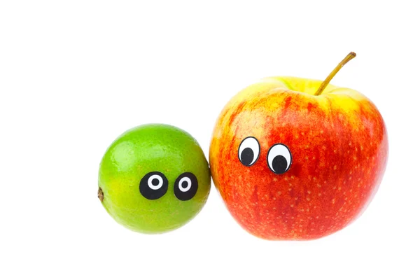 Limão e maçã com olhos e rostos isolados em branco — Fotografia de Stock