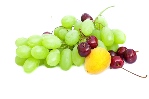 Grapes, apricots and cherries isolated on white — Stock Photo, Image