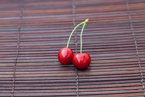 Cherry on a bamboo mat — Stock Photo, Image