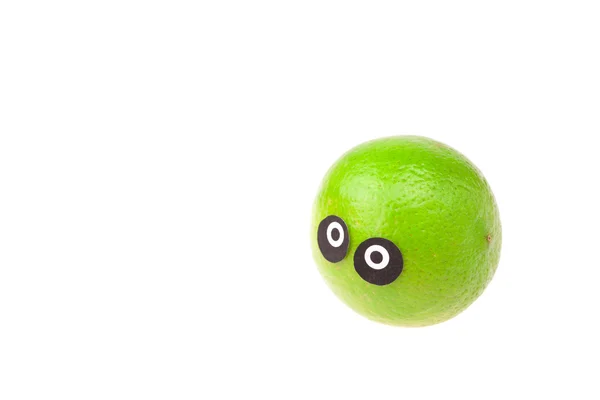 Lime met ogen en gezichten geïsoleerd op wit — Stockfoto