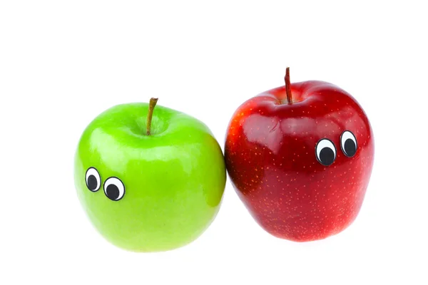 Jablka s očima a izolované na bílém — Stock fotografie