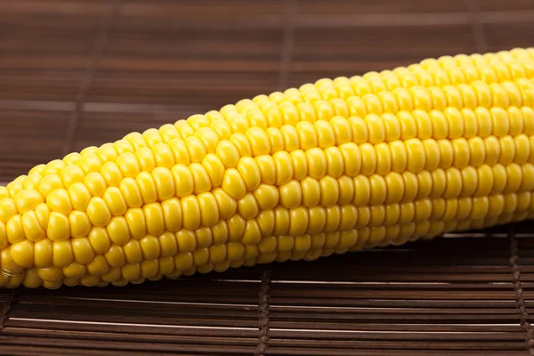 Corn lying on a bamboo mat — Stock Photo, Image