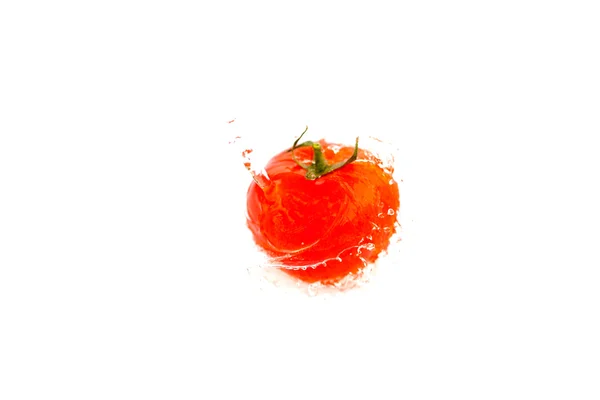 Tomatoes with splashes of water isolated on white — Stock Photo, Image